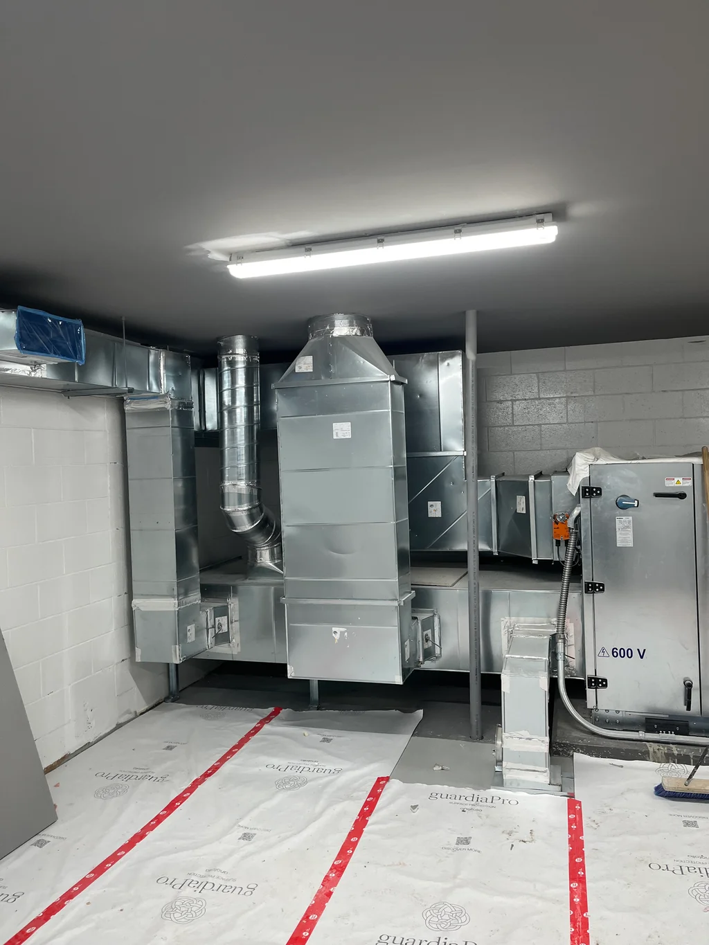Equipment and ductwork in the mechanical room at the Parc Ducharme chalet